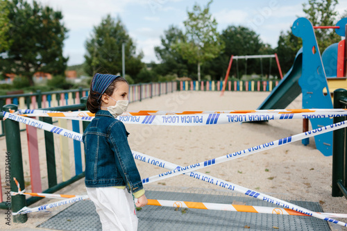 Kid looking at sealed playground photo