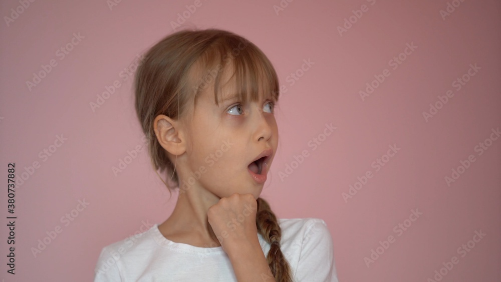 Surprised little girl. Isolate on pink background Surprised little girl. Isolate on pink background