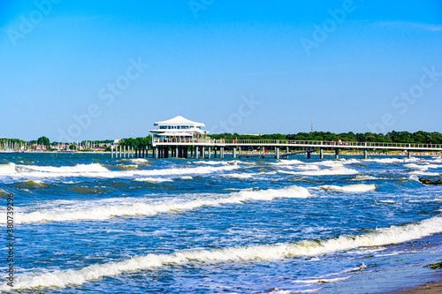 Beach, house with a footbridge in Timmendorfer Strand nearby Lubeck - Travemunde (Travemünde) on baltic sea. Schleswig-Holstein, Germany.