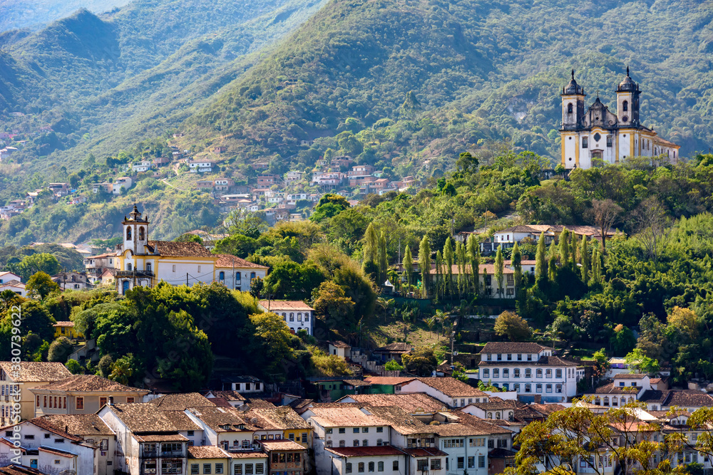 View from the top of the historic center of Ouro Preto with its houses, church, monuments and mountains