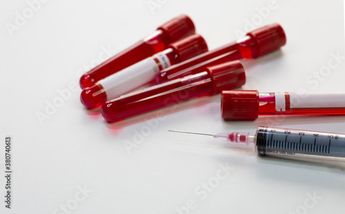 Injection syringe with blood test sample vials of patients