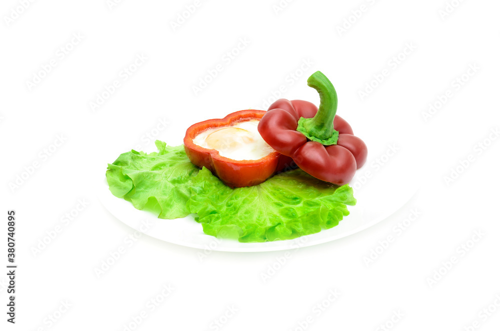 egg cooked in red sweet peppers on a white background egg cooked in red sweet peppers on a white background
