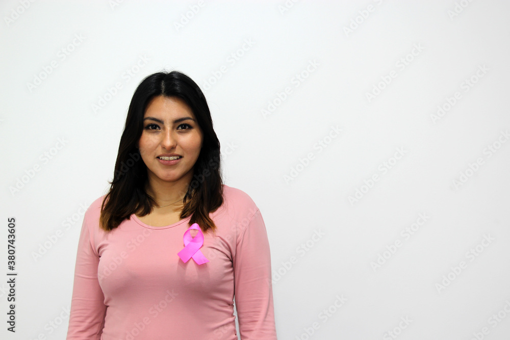 latin woman with pink blouse and pink ribbon for campaign against breast cancer on white background
latin woman with pink blouse and pink ribbon for campaign against breast cancer on white background