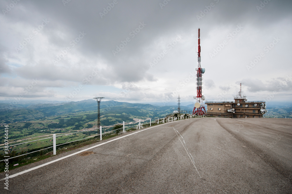 Spectacular view of Picos de Europa mountain range and asphalt roadway on cloudy day in Asturias Spectacular view of Picos de Europa mountain range and asphalt roadway on cloudy day in Asturias