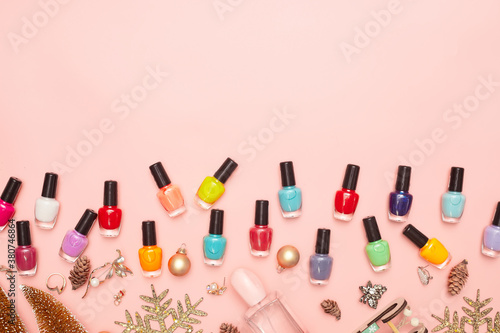 christmas concept, new year, manicure with nail polish, pedicure on pink background, copy space, Flat Lay