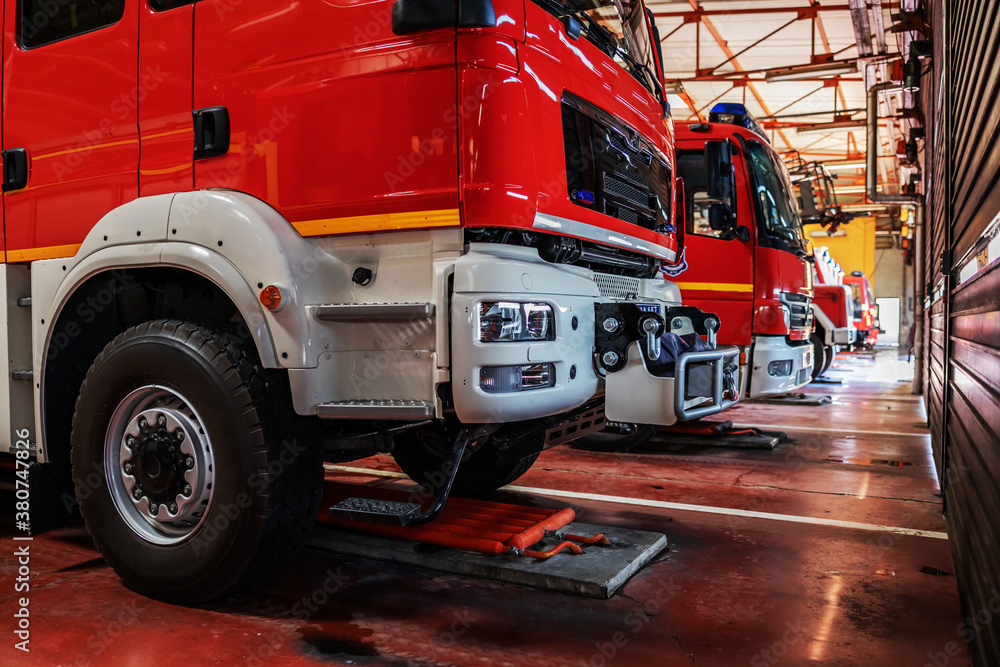 Fire trucks parked in fire brigade prepared for action. Fire trucks parked in fire brigade prepared for action.