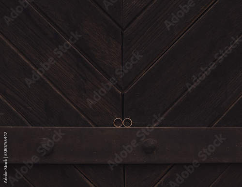 wedding rings bride and groom on the wooden background. Wedding ceremony. Jewelry.