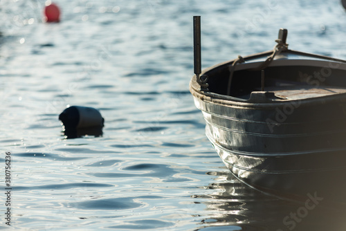 Shabby boat on calm sea in Sa Caleta photo