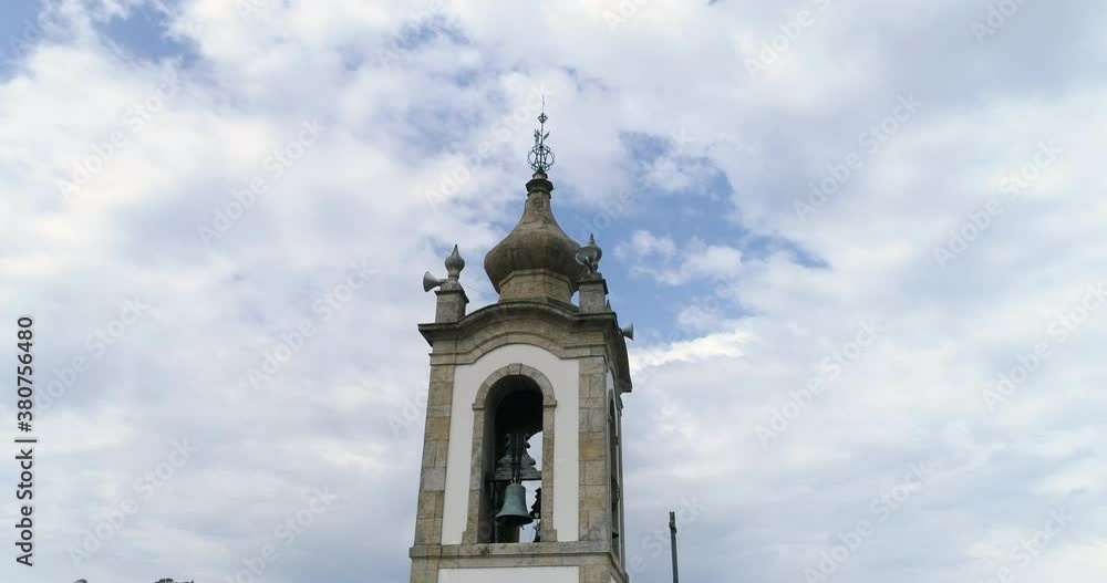 Close Up Details Of A Bell Tower Of A Church Against Blue Sky With White Clouds low angle orbiting shot Close Up Details Of A Bell Tower Of A Church Against Blue Sky With White Clouds low angle orbiting shot