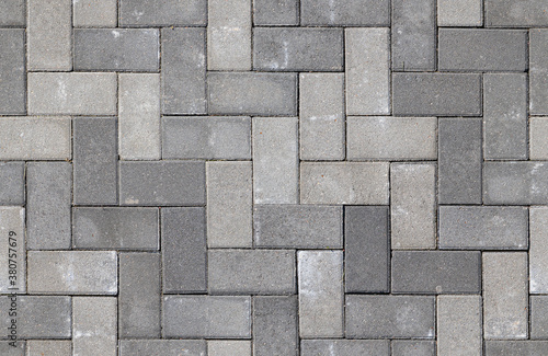 Seamless texture of street tiles. Pattern of gray sidewalk tiles.