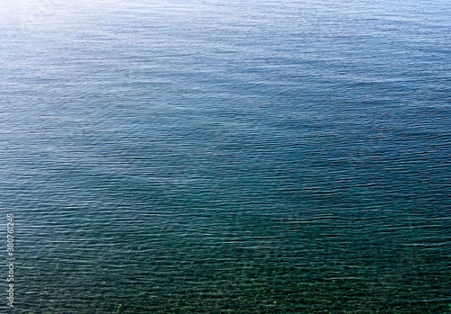 blue sea water surface. calm water background. light ripple.