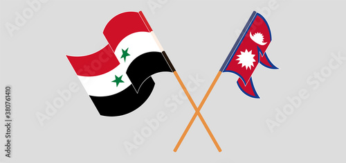 Crossed and waving flags of Nepal and Syria