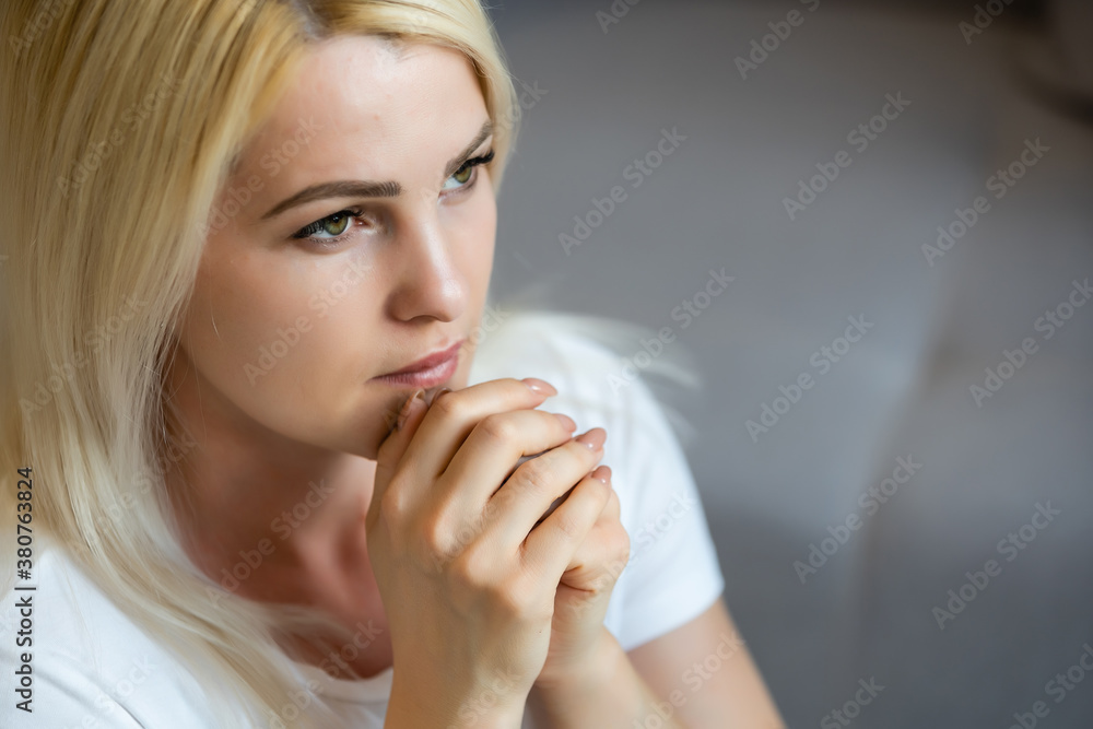 Closeup portrait of a young caucasian woman praying Closeup portrait of a young caucasian woman praying