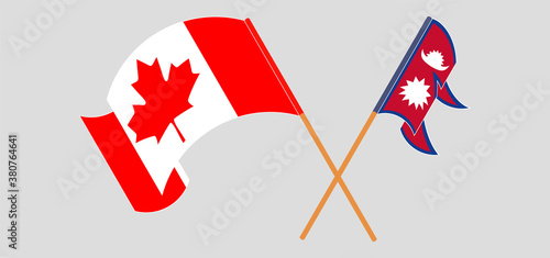 Crossed and waving flags of Nepal and Canada