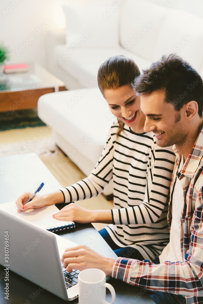 Young Happy Couple Working at Home Young Happy Couple Working at Home