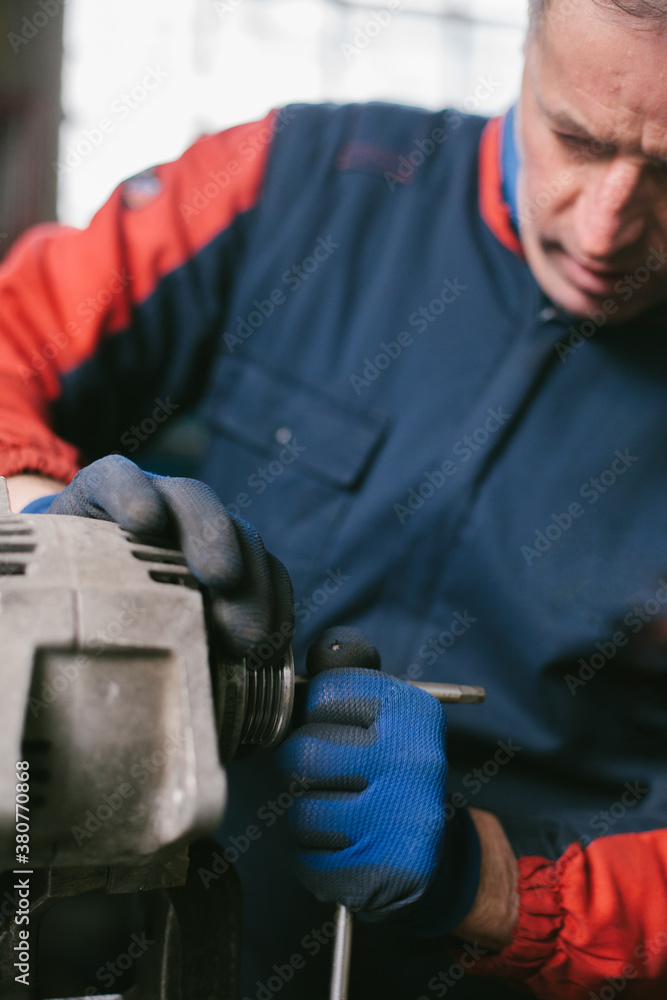 Mechanic working in auto repair shop Mechanic working in auto repair shop