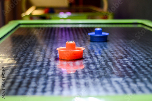 Close-up of Air hockey with paddle. Air hockey game table.  photo