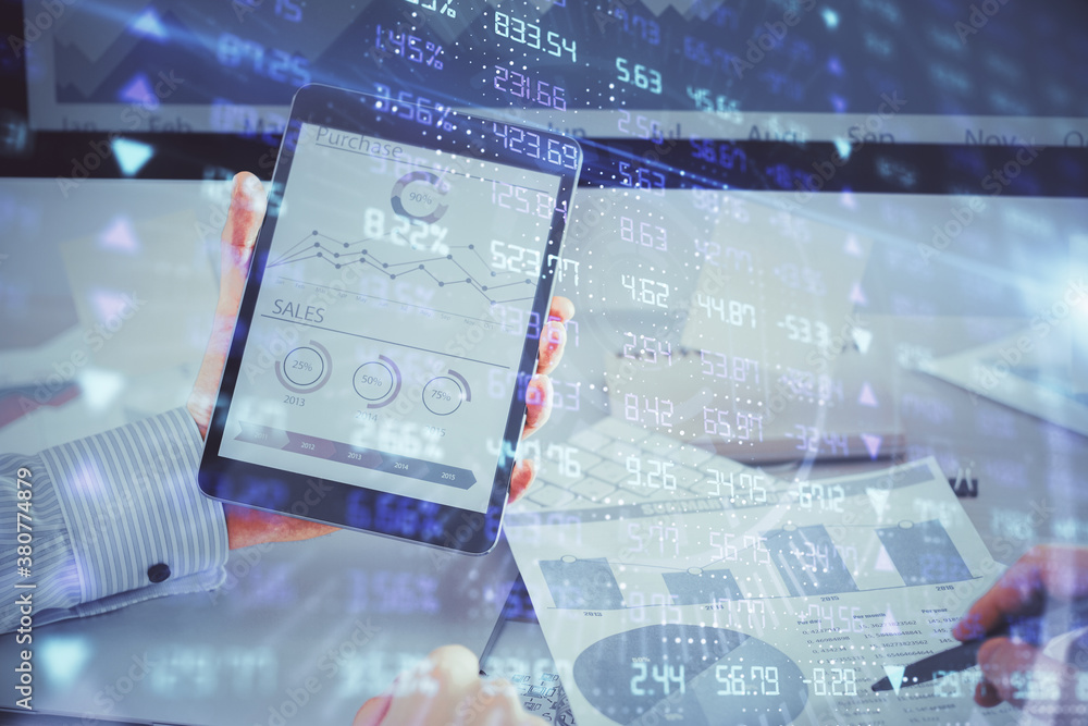 Double exposure of man's hands holding and using a digital device and forex graph drawing. Financial market concept. Double exposure of man's hands holding and using a digital device and forex graph drawing. Financial market concept.