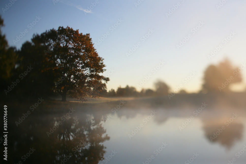 Sunrise Over A Lake On A Foggy Autumn Morning In Michigan Sunrise Over A Lake On A Foggy Autumn Morning In Michigan