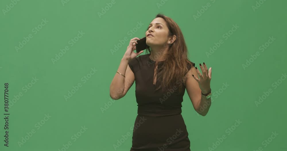 Studio, slow motion, green screen, an animated young female talks on the phone, London, UK Studio, slow motion, green screen, an animated young female talks on the phone, London, UK