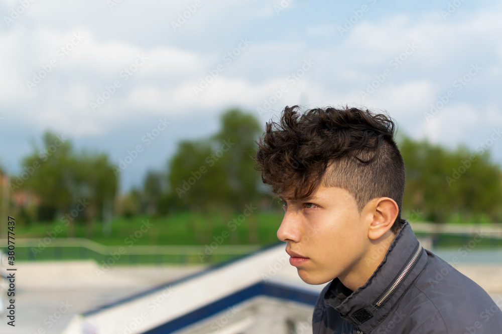 Teenager with green eyes at a skate park Teenager with green eyes at a skate park