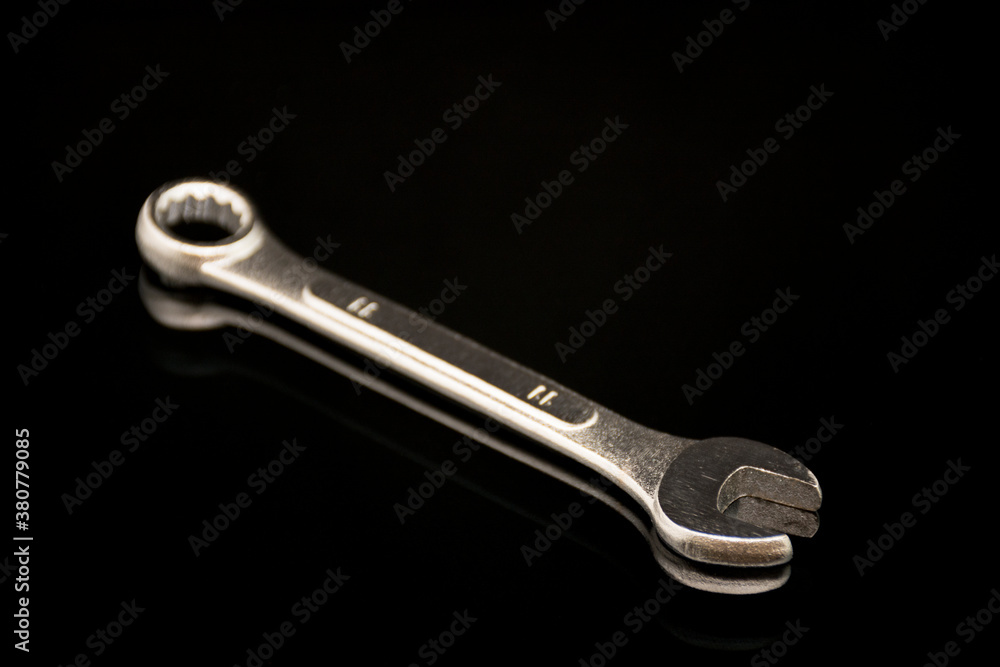 Metal wrench for nut.