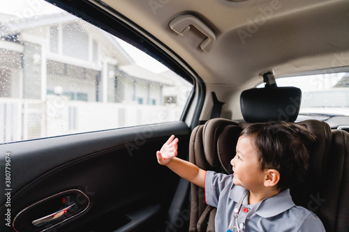Back to School Concept.Happy Funny little asian boy raising hands thumb up and very excited and glad when he go back to school.Child from elementary school kindergarten.Safe trip safe drive.Traveller. © MIA Studio