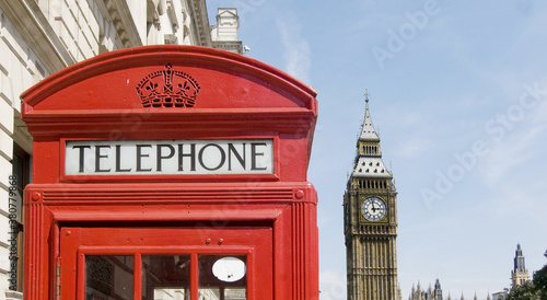 Westminster  London with traditional red Telephone box and Big Ben in background.