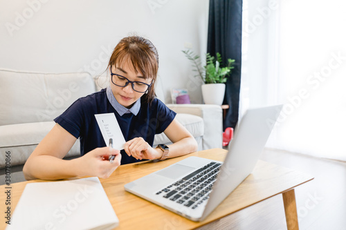 Asian woman teacher teaching English phonic sound in coronavirus covid19 crisis.Lockdown and Teach online class at home.Distance learning, Online education, New normal, Education, Social distancing.