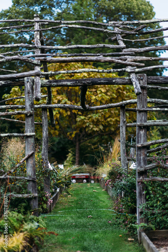 Wood terrace leading a path in a flower garden