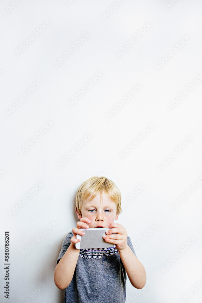 Child using a smart phone Child using a smart phone