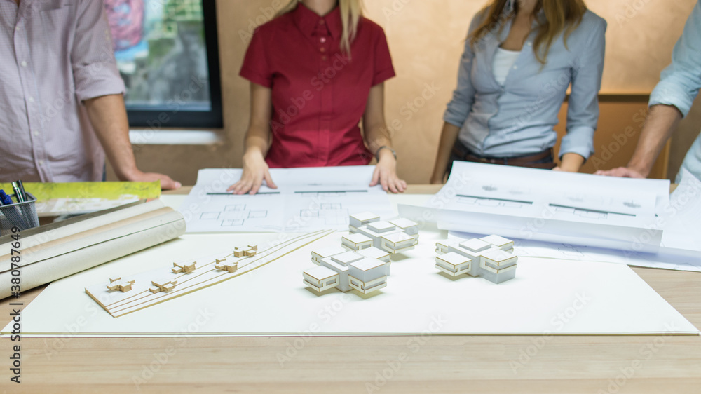 Group Of Anonymous People Working On Architectural Scale Models Group Of Anonymous People Working On Architectural Scale Models