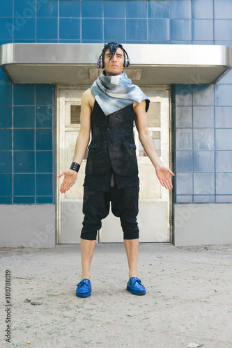 Futurustic Male Fashion against Affordable Public Housing Project photo