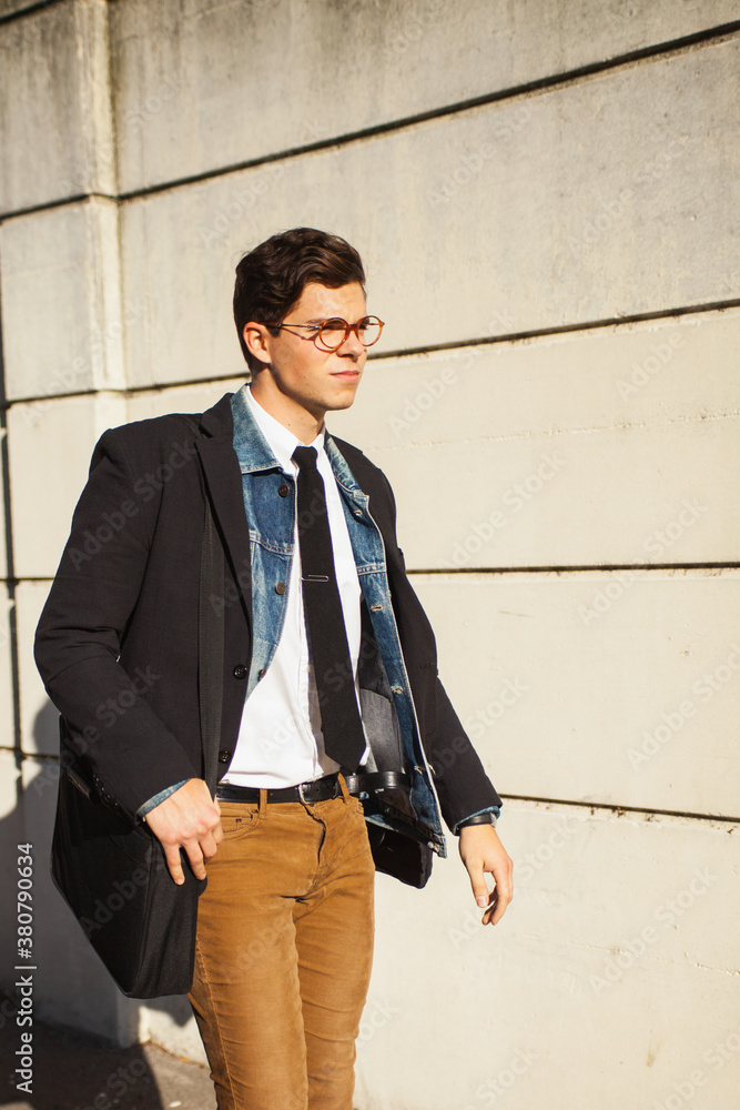 Young hip guy walking to work. Young hip guy walking to work.