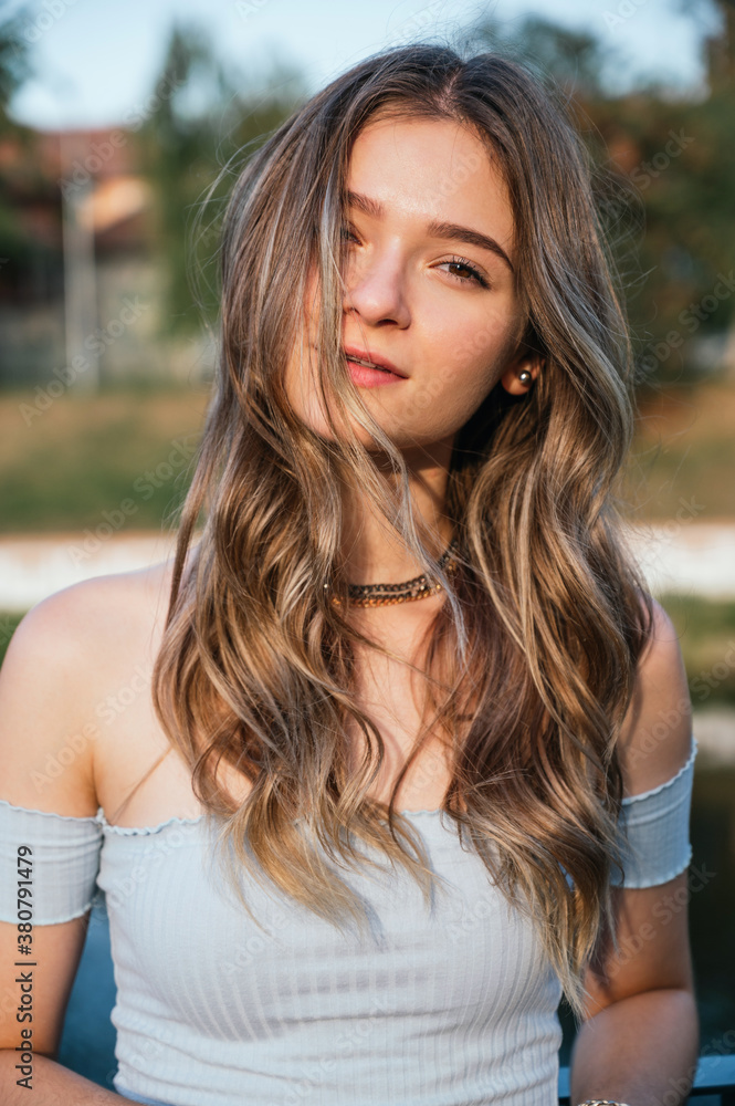 Portrait of beautiful young woman at sunset Portrait of beautiful young woman at sunset