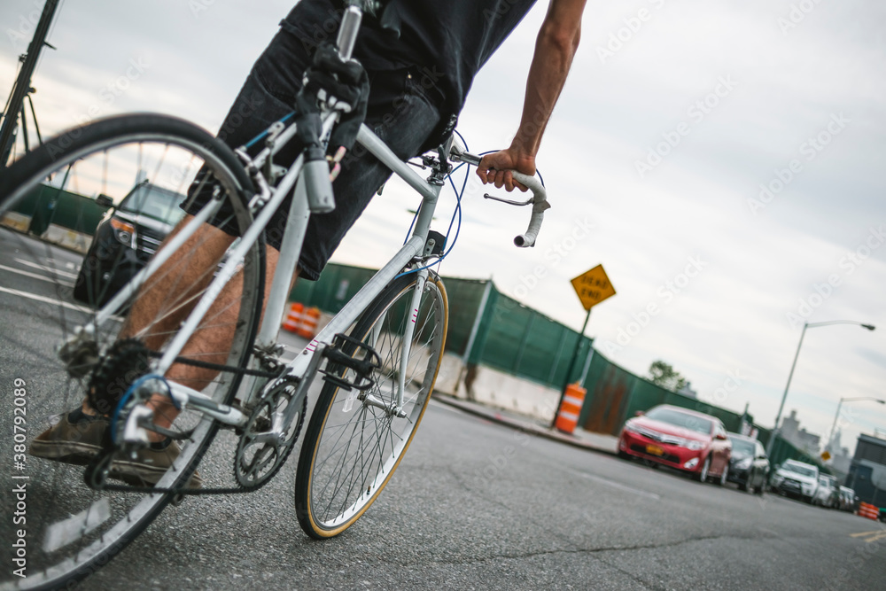 Man riding a bicycle in urban area Man riding a bicycle in urban area