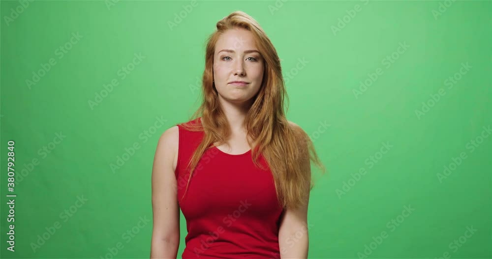Redhead young woman dancing and laughing, greenscreen, slow motion Redhead young woman dancing and laughing, greenscreen, slow motion