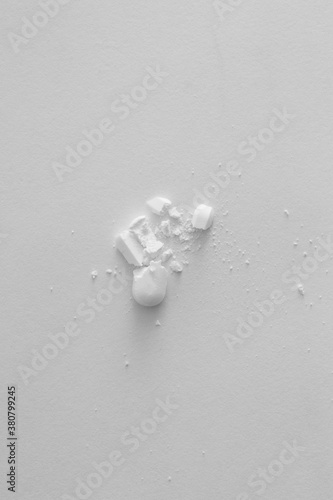 Pill broken on white background photo