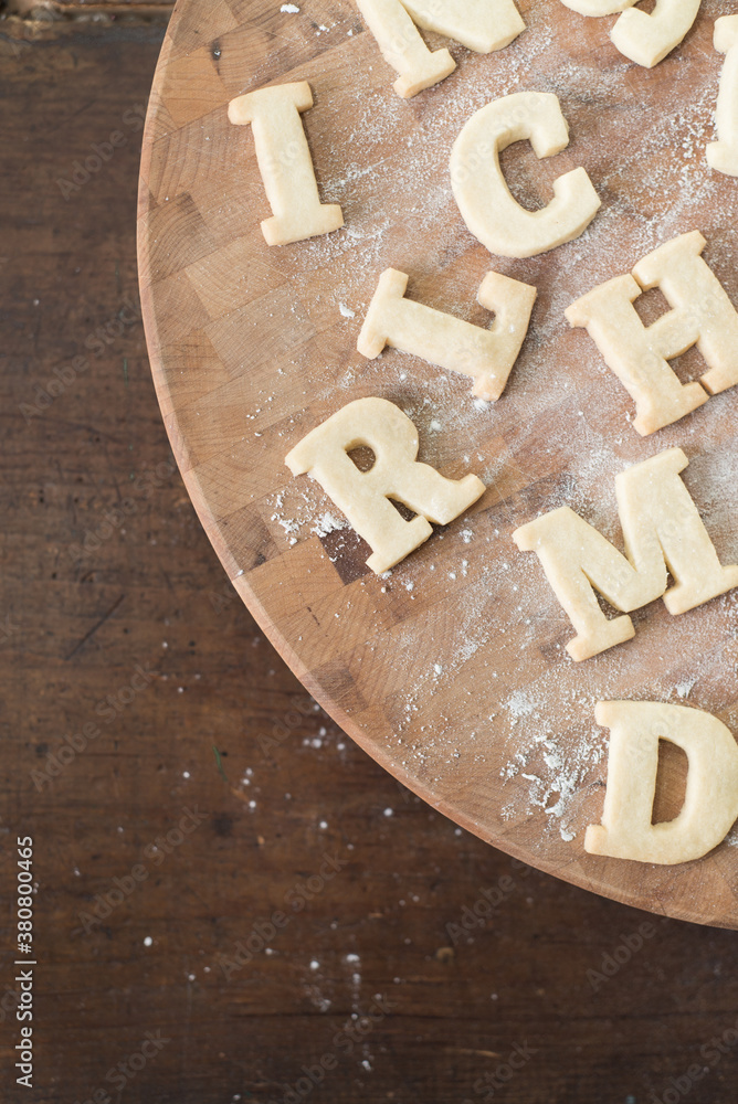 Shortbread Cookie Letters scattered on surface Shortbread Cookie Letters scattered on surface