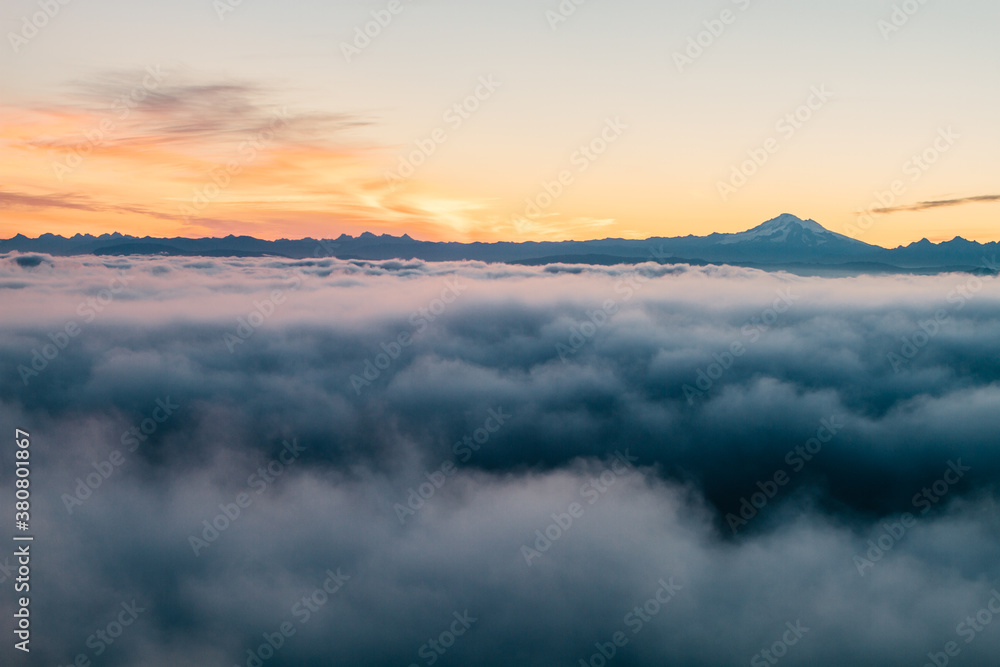 Aerial view of thick low clouds and mountains at sunrise Aerial view of thick low clouds and mountains at sunrise