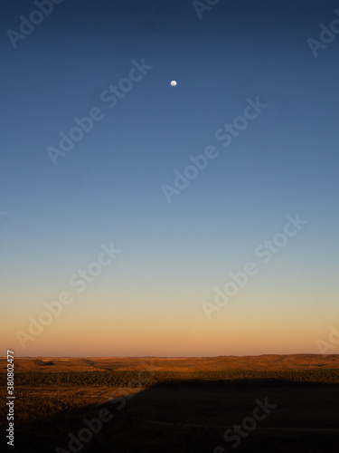 Sunset over the Australian Outback  a full moon making an appearance