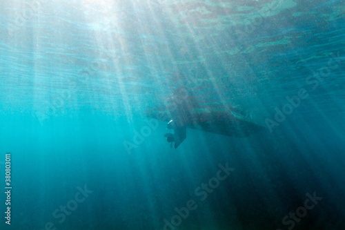 Bottom of the boat seen from underwater photo