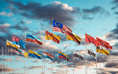 All Flags of States and territories of Malaysia waving in the sky. Flag of Selangor, Kuala Lumpur, Sabah, Johor, Sarawak, Perak, Kedah, Kelantan, Penang etc as at Putra Square, Putrajaya.  photo