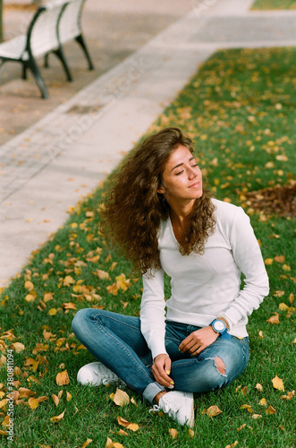 Young wonan enjoys sunny autumn day photo