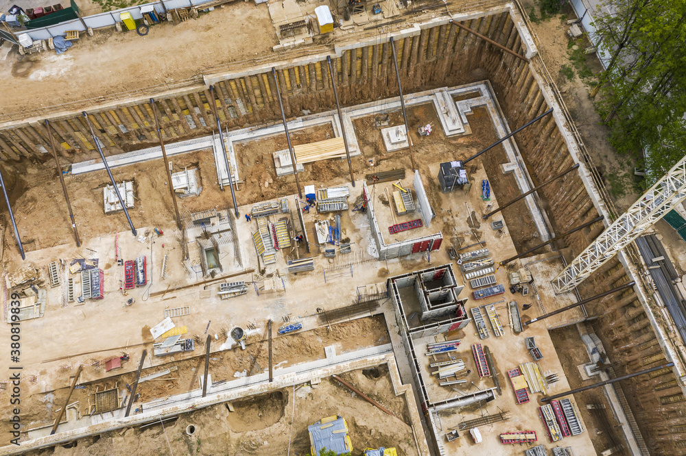 concrete foundations of future apartment building under construction. aerial view