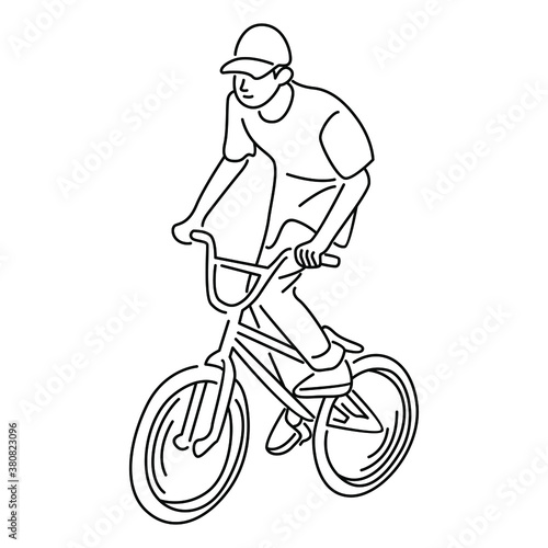 Young boy showing off freestyle trick with bicycle