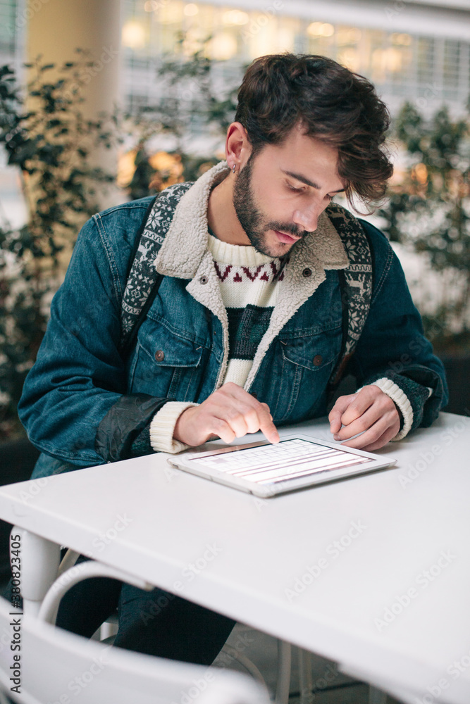 Young man using digital tablet Young man using digital tablet