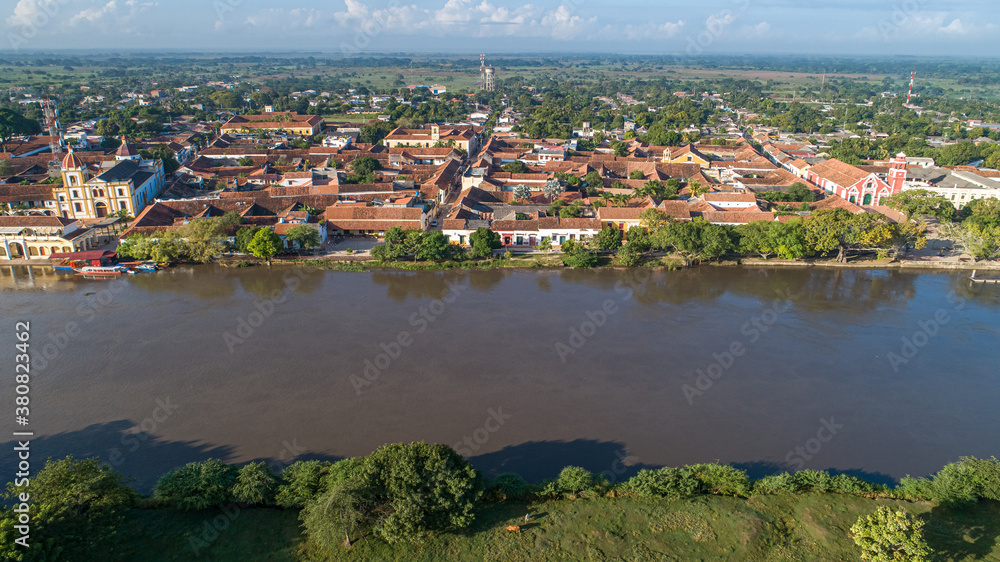 Aerial view of the historic town Santa Cruz de Mompox in sunlight from the riverside, World Heritage
