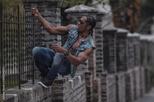 black boy hanging on the fence