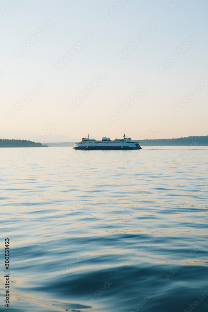 Washington State ferry boat on calm waters of Puget Sound at dusk Washington State ferry boat on calm waters of Puget Sound at dusk